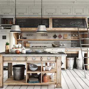 2 Ashland pendant lights hanging above a kitchen island in an industrial style kitchen.