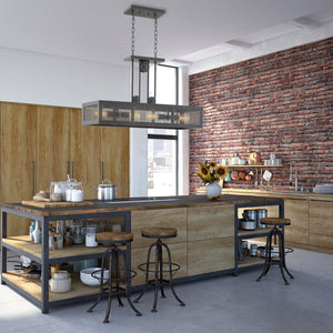 Industrial Rhome linear chandelier hanging above a kitchen island made of wood and metal. Very Rustic industrial kitchen..