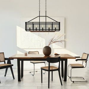 5 light Gateway cages linear chandelier above a wooden dining table..