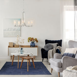 5 Light Devonshire chandelier in brushed nickel finish hanging in a living room.