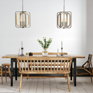 Two 4 light locked frame Woodland chandeliers above a long dining table. 