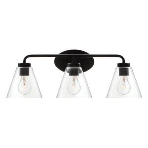 Regis vanity light in matte black with clear shade lit.