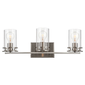 3 light Devonshire vanity in brushed nickel lit.