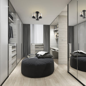 Devonshire matte black semi flush mount in a grey and black modern walk in closet. .